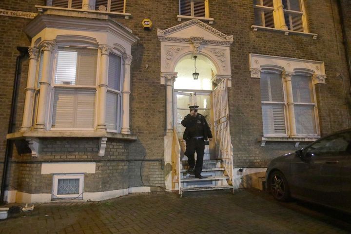 A police officer outside Tudos' house, which was near the park