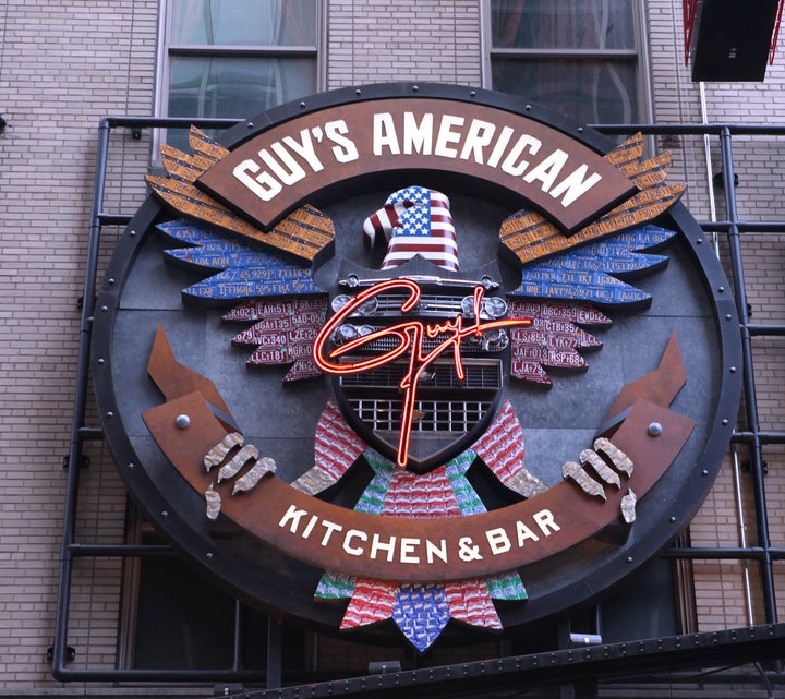 The exterior marquee for Guy's American Kitchen and Bar in Times Square, New York City.