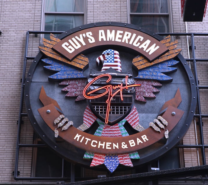 The exterior marquee for Guy's American Kitchen and Bar in Times Square, New York City. 