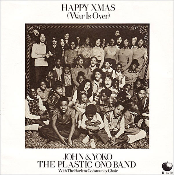 <p>“Happy Xmas (War Is Over)” record sleeve. Producer Phil Spector is visible on the top left, standing next to May Pang, John and Yoko’s assistant.</p>