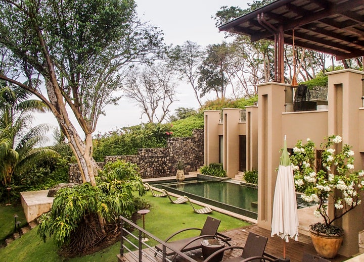 <p>Hidden outdoor features, with shade trees, grass and a pool, attract monkeys, hummingbirds, butterflies and birds, Villa Manzu, Costa Rica. </p>