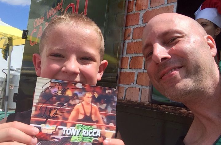 <p>Tony Ricca with a young fan.</p>