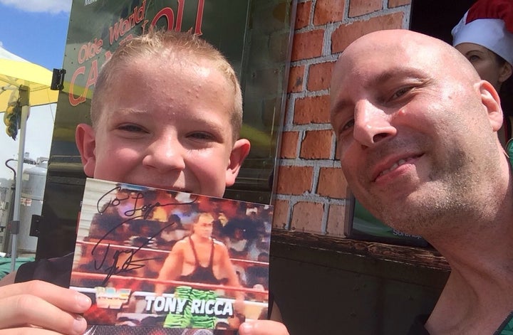 Tony Ricca with a young fan.