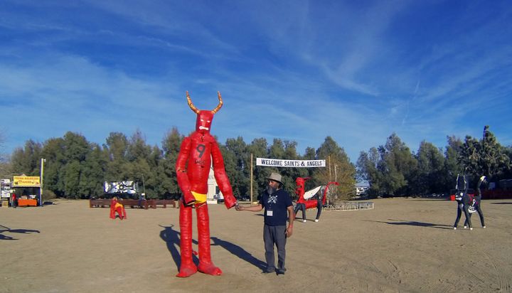 Festival founder Rolo Castillo chilling with one of his devil creations.