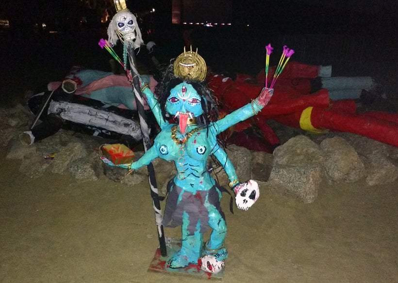 One effigy remains in front of the fire pit.