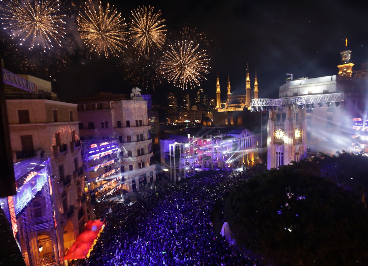 Fireworks explode over downtown Beirut, Lebanon during New Year's celebrations on January 1, 2018.