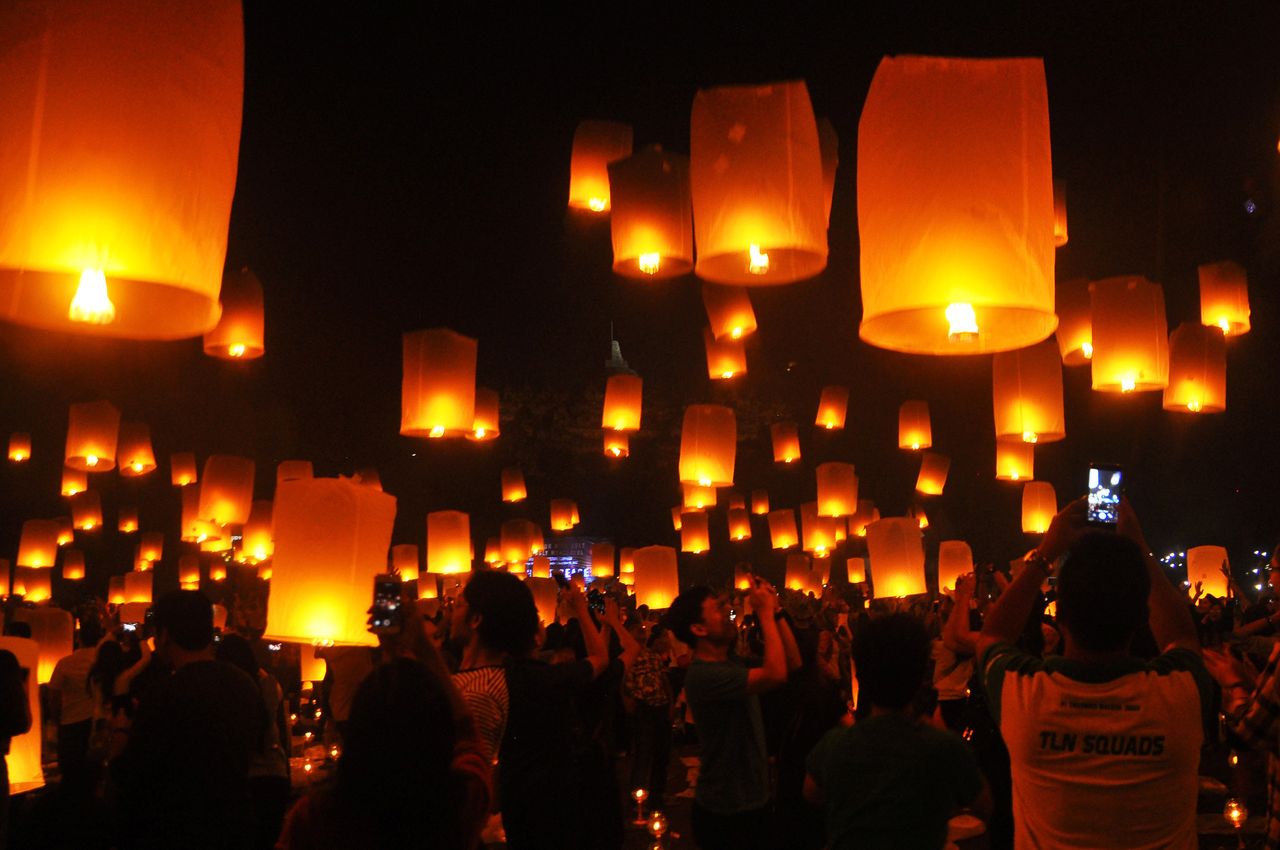People fly lanterns at Borobudur Temple during New Year's celebrations in Magelang, Indonesia on January 1, 2018.