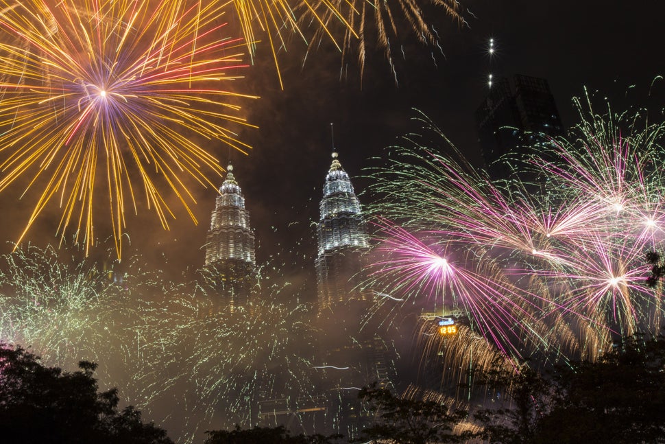 Fireworks light up the sky over Petronas Towers during New Year's celebrations in Kuala Lumpur, Malaysia on December 31, 2017.