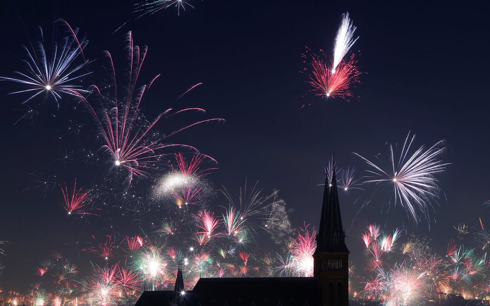 Fireworks explode around Familienkirche church during New Year's celebrations in Vienna, Austria on January 1, 2018.