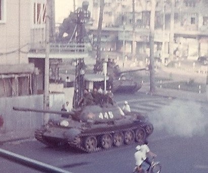 May 1, 1975 North Vietnamese tank turns from Lam Son Square down Tu Do Street toward the waterfront