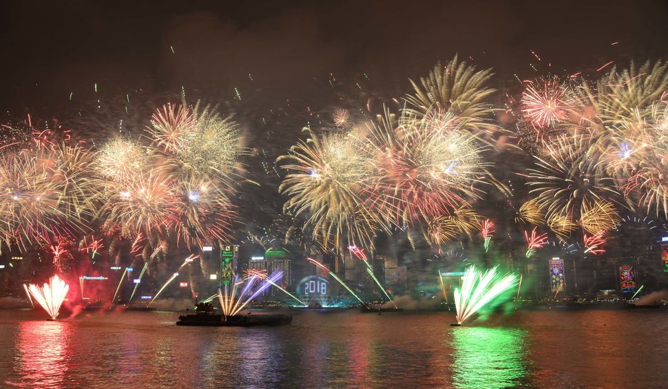 Fireworks explode over Victoria Harbour on New Year's Eve in Hong Kong, China.