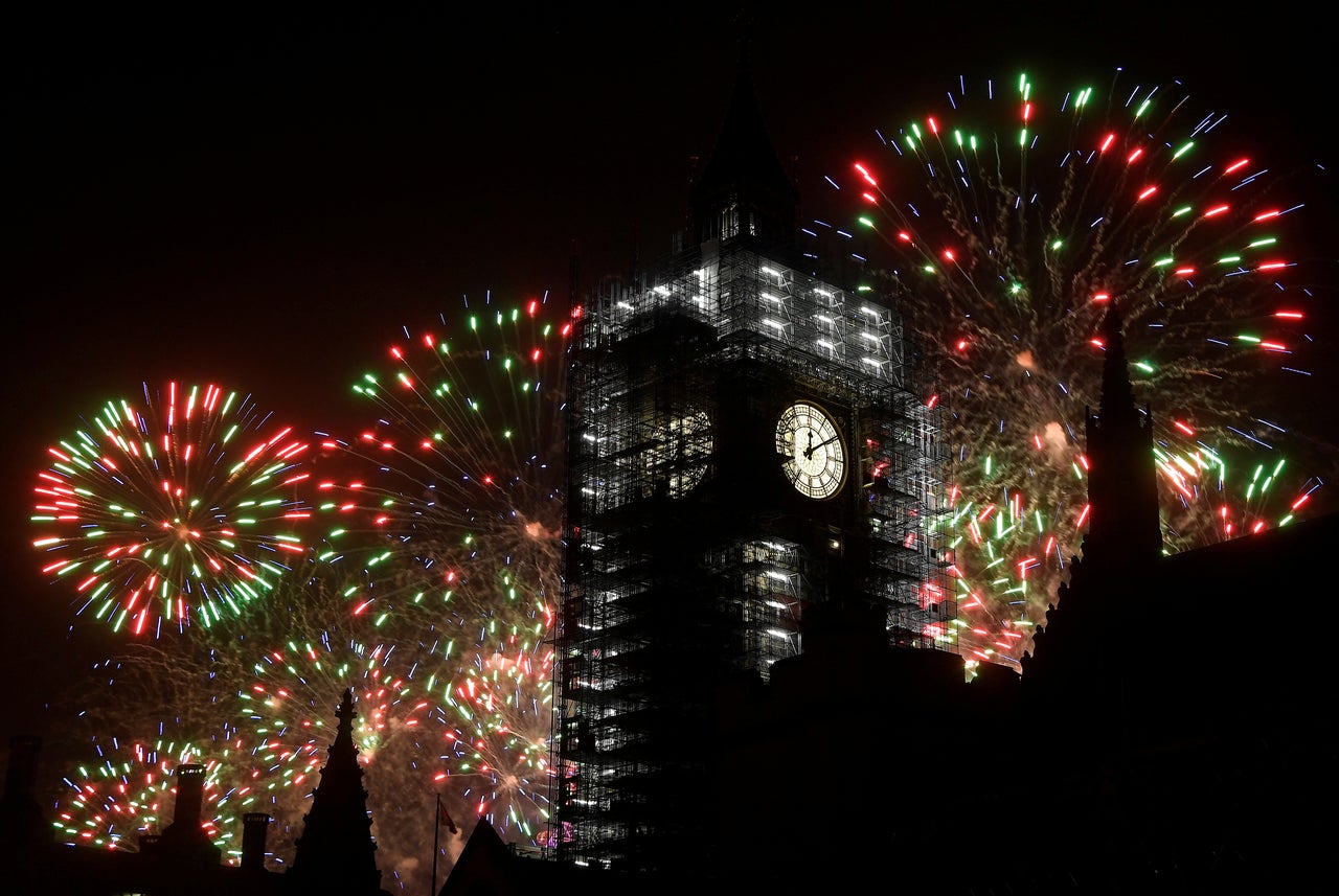 Fireworks explode behind Big Ben during New Year's celebrations in London on January 1, 2018.