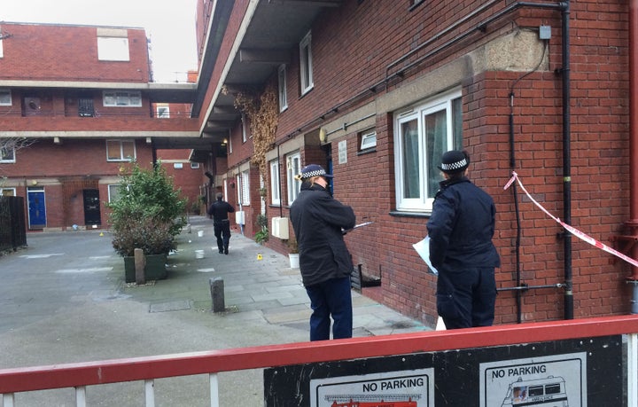 Police at the scene of a stabbing at Bartholomew Court, Old Street in London. Four people have been stabbed to death during a string of apparently unrelated murders in London during a 24-hour period, police said.