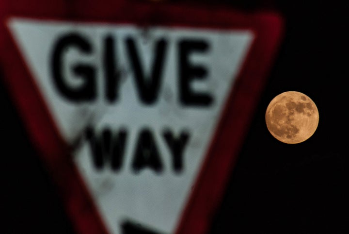 The first supermoon of the year, as seen appearing in Leominster, England.