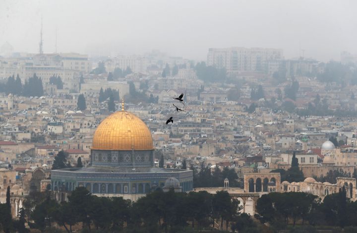 Birds fly on a foggy day near the Dome of the Rock, located in Jerusalem's Old City on the compound known to Muslims as Noble Sanctuary and to Jews as Temple Mount, Jerusalem, January 2, 2018. (REUTERS/Ammar Awad)