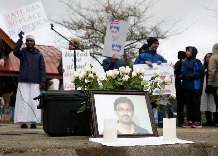 A photo of Srinivas Kuchibhotla, the 32-year-old Indian engineer killed at a bar in Olathe, Kansas, is pictured during a peac