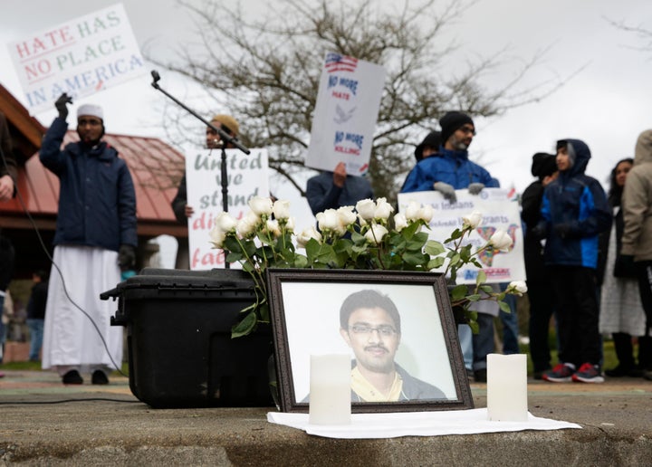 A photo of Srinivas Kuchibhotla, the 32-year-old Indian engineer killed at a bar in Olathe, Kansas, is pictured during a peace vigil in Bellevue, Washington, on March 5, 2017.