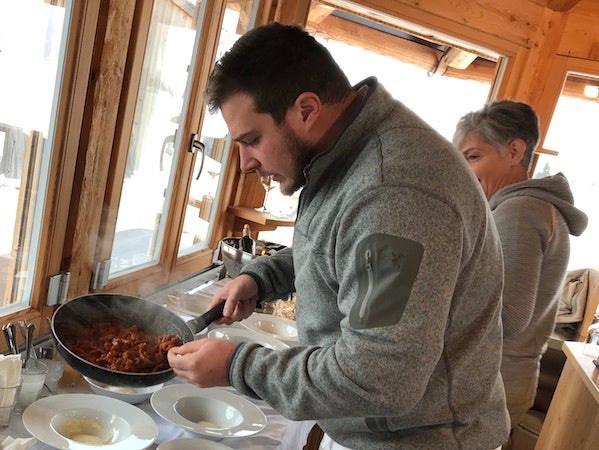 Matteo Metullio in the kitchen, watched by Mamma
