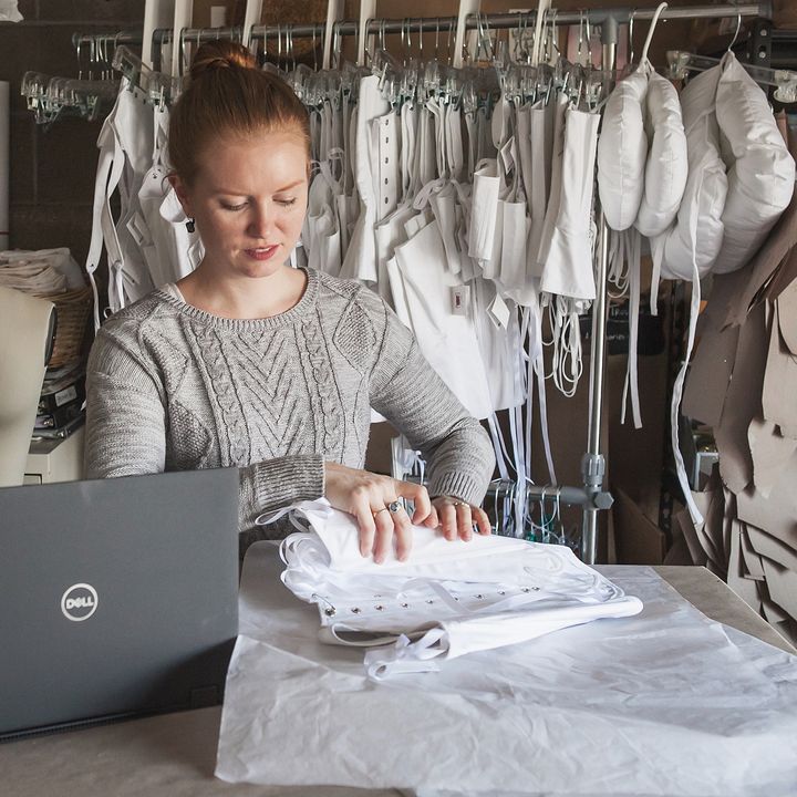 Cynthia Settje, founder of Red Threaded Costume company, works on costumes with her Dell Latitude 2-in-1. 