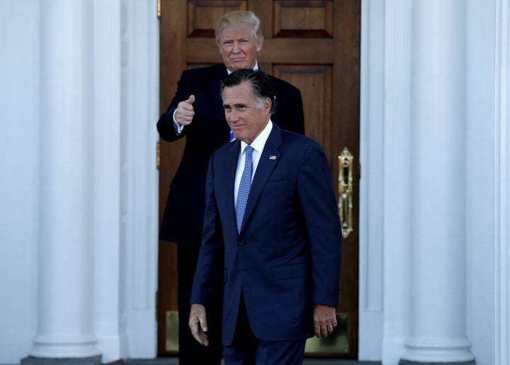 Then-President-elect Donald Trump gives a thumbs up as Romney exits a meeting with him at the main clubhouse of the Trump National Golf Course in Bedminster, New Jersey, on Nov. 19, 2016. 