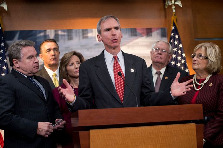 Rep. Dan Lipinski (D-Ill.), center, is fending off a liberal primary challenge from businesswoman Marie Newman. Newman has the backing of major progressive groups.