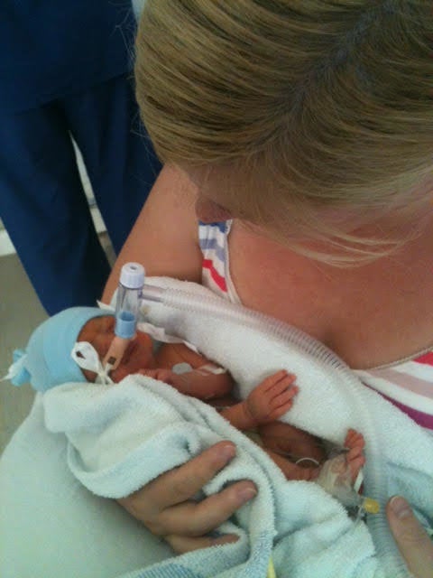 Catriona Ogilvy holding her son Sam for the first time at six days old.