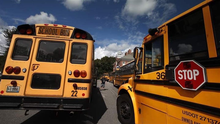 School buses await students at a York, Maine, middle school. Clean-energy advocates say school buses are likely targets for state programs for diesel replacement.