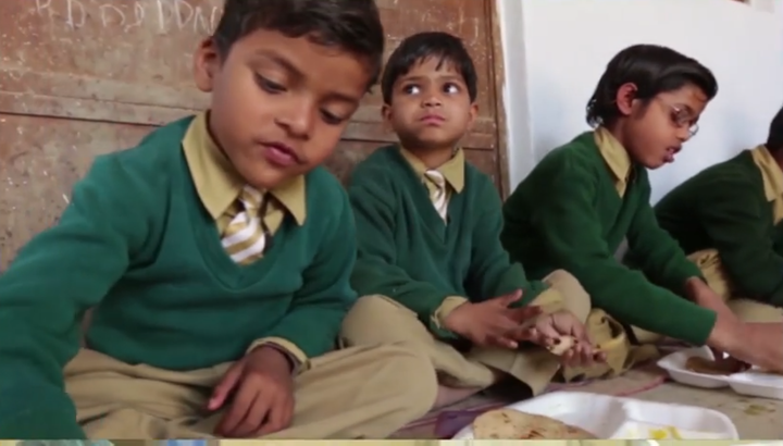 Schoolchildren eating Akshaya Patra-provided meal.