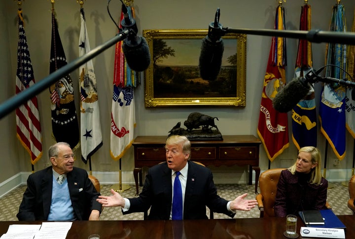 Sen. Chuck Grassley (R-Iowa) and Homeland Security Secretary Kirstjen Nielsen sit next to President Donald Trump at a meeting to discuss immigration.