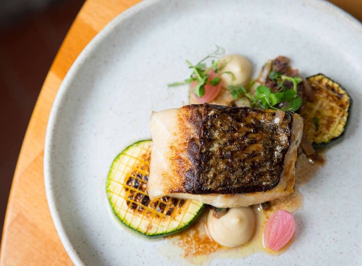 <p>A glass of Bodegas Albamar (2015) provides a mouthful of minerality with a splash of salinity and serves as a fitting complement to the sea bass in brown butter with grilled zucchini and endive. </p>
