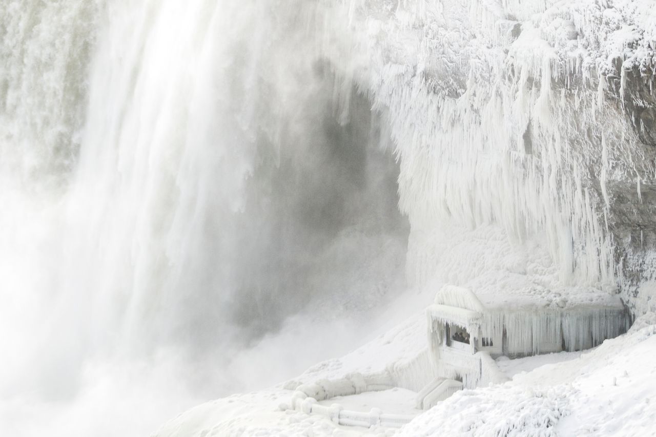 Ice coats the rocks and observation deck at the base of Horseshoe falls in Niagara Falls, Ontario. 