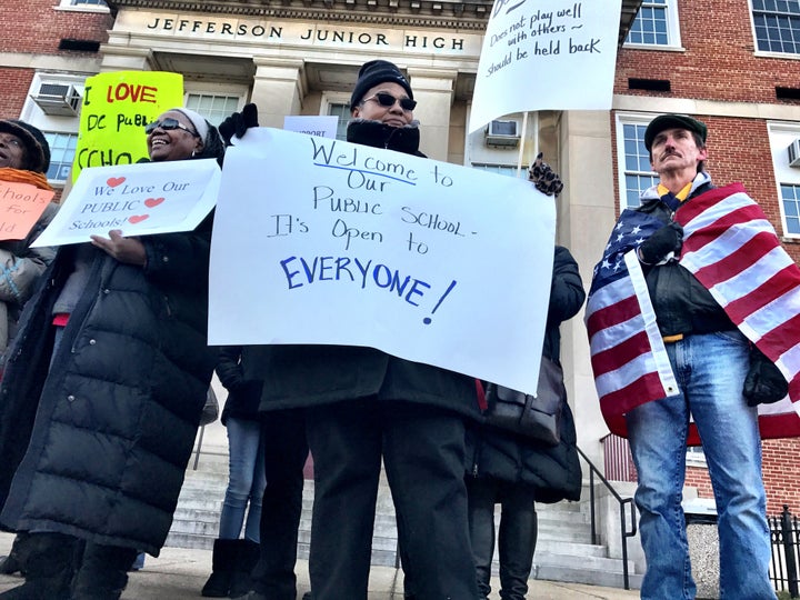 Demonstrators last February wait for the arrival of DeVos at Jefferson Middle School Academy.