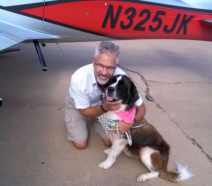 Kinsinger in a photo provided by Pilots N Paws, seen with a dog named Big Sid.