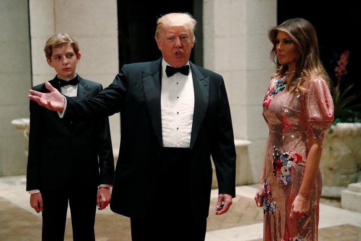 Barron Trump, his father and Melania pictured on New Year's Eve.