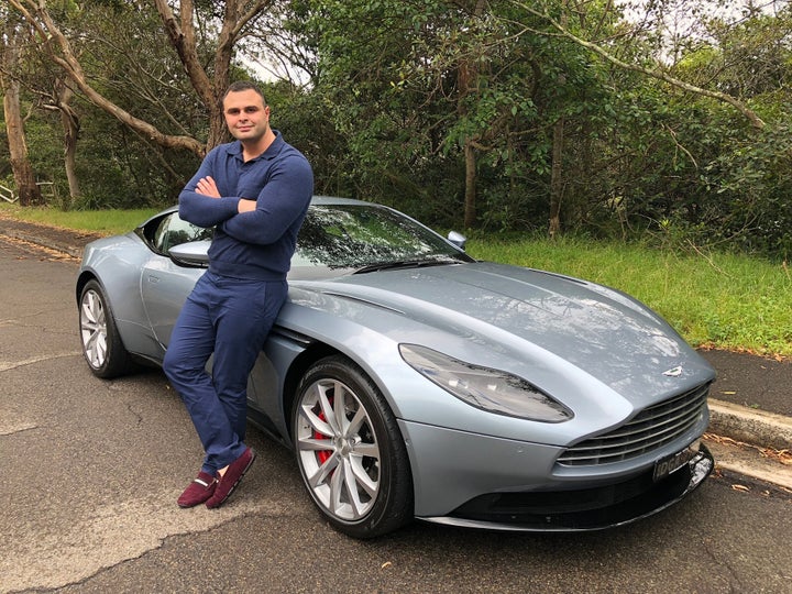 <p>Lecha Khouri beside the 2017 Aston Martin DB11</p>