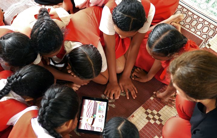 <p>Students in Tonga engaging with an educational game together with producers from Millipede, an Australian innovation company specializing in mobile games. </p>