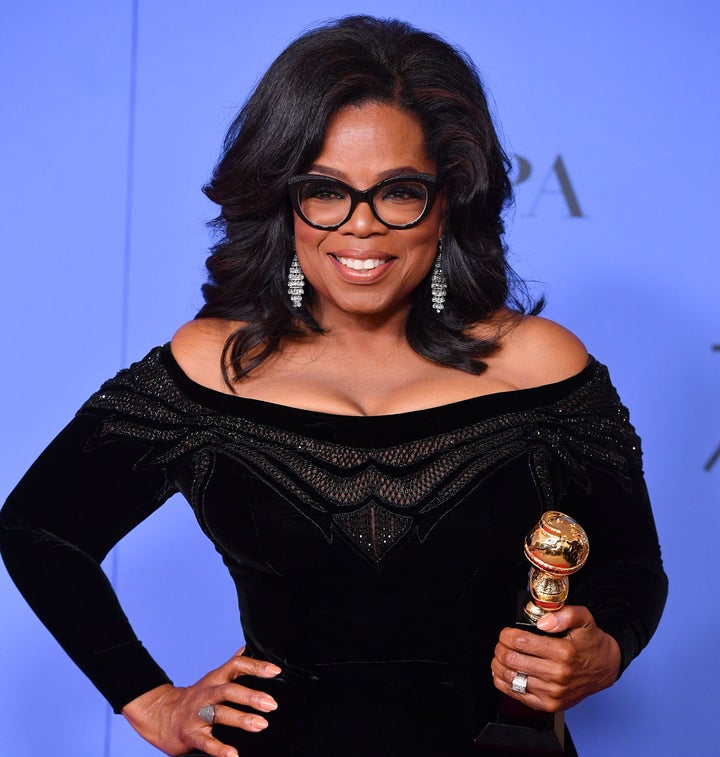 Oprah Winfrey poses with the Cecil B. DeMille Award at the 75th Annual Golden Globe Awards on Sunday.