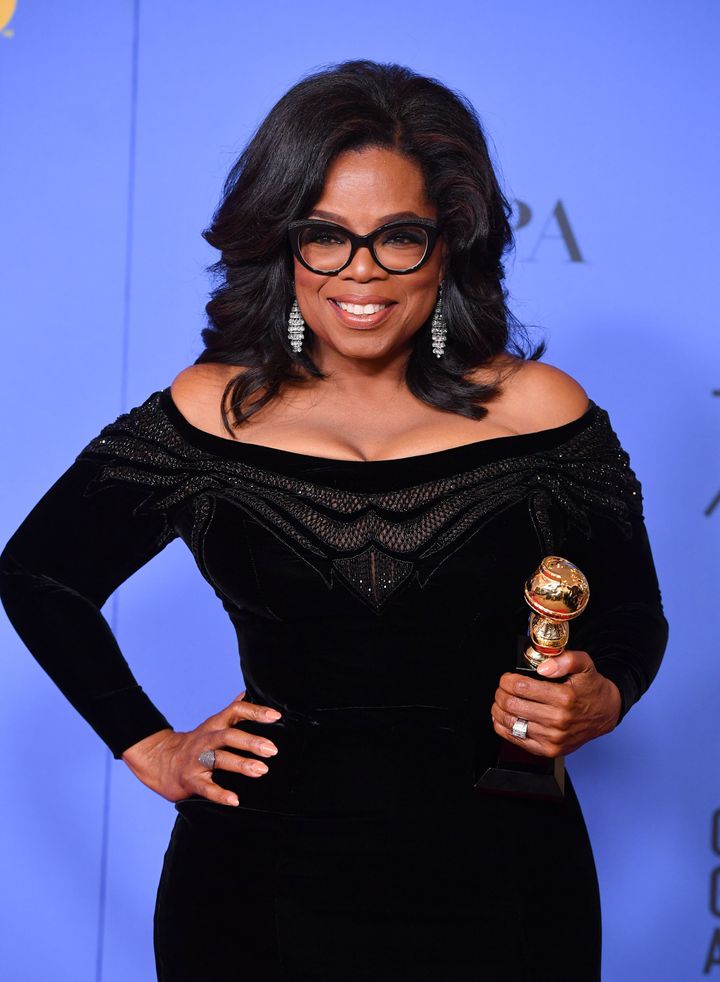 Oprah Winfrey poses with the Cecil B. DeMille Award at the 75th Annual Golden Globe Awards on Sunday.