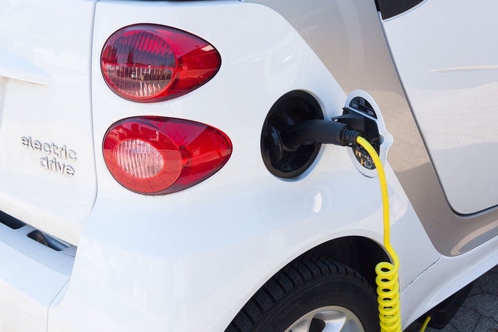 Electric vehicle connected to charging station