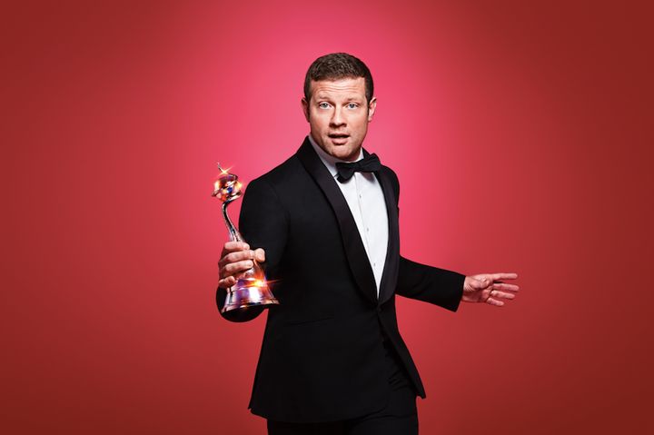 We're not sure why Dermot looks as though he's stolen this trophy