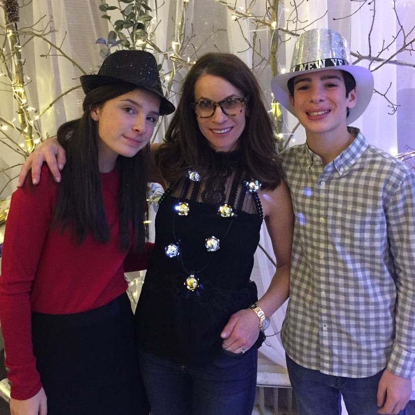 Celebrating the new year with my daughter, Julia (left), and my son, Daniel (right), after my smile was restored!