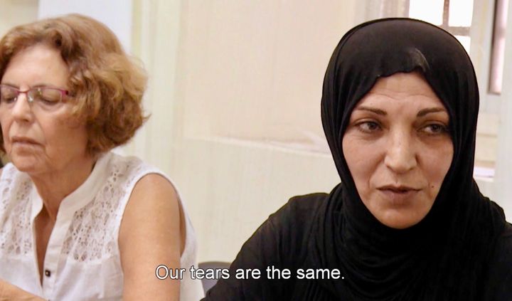 <p><strong>As part of the Parents Circle Families Forum, a Palestinian mother whose son was killed by Israeli soldiers sits at a table with Jewish mothers who lost family to Palestinian attacks in </strong><em>West of the Jordan River</em>. </p>