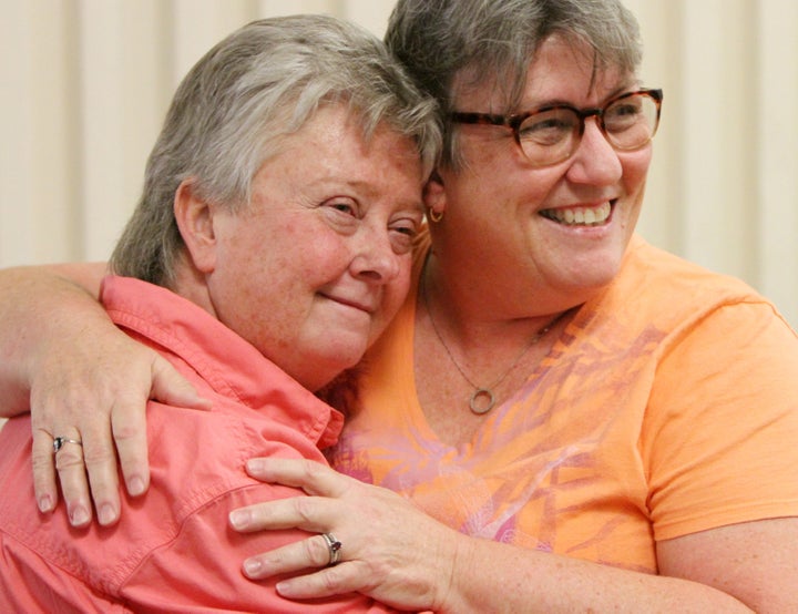 Bobbi Gray (left) and Celeste Swain of Gulfport, Mississippi, pose for photos at the courthouse after getting married on June 29, 2015. Their wedding was the first state-sanctioned same-sex marriage ceremony in Harrison County, Mississippi.