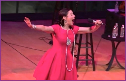 Meghan Picerno sings <a rel="nofollow" href="https://www.youtube.com/watch?v=jLhqS68P6J4" target="_blank">"Glitter and b