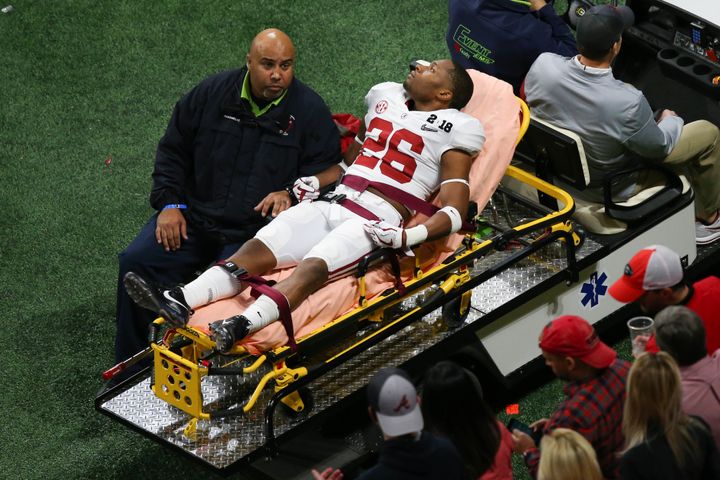Alabama defensive back Kyriq McDonald (26) appeared to be awake and alert as he was taken off the field.