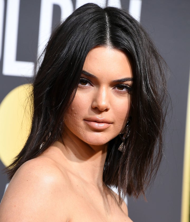 Model Kendall Jenner, pictured at the Golden Globes with some blemishes, just got more beautiful in the eyes of some fans for encouraging them to not let acne in the way.