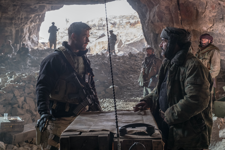 Chris Hemsworth as Captain Mitch Nelson and Navid Negahban as General Dostum in "12 Strong."