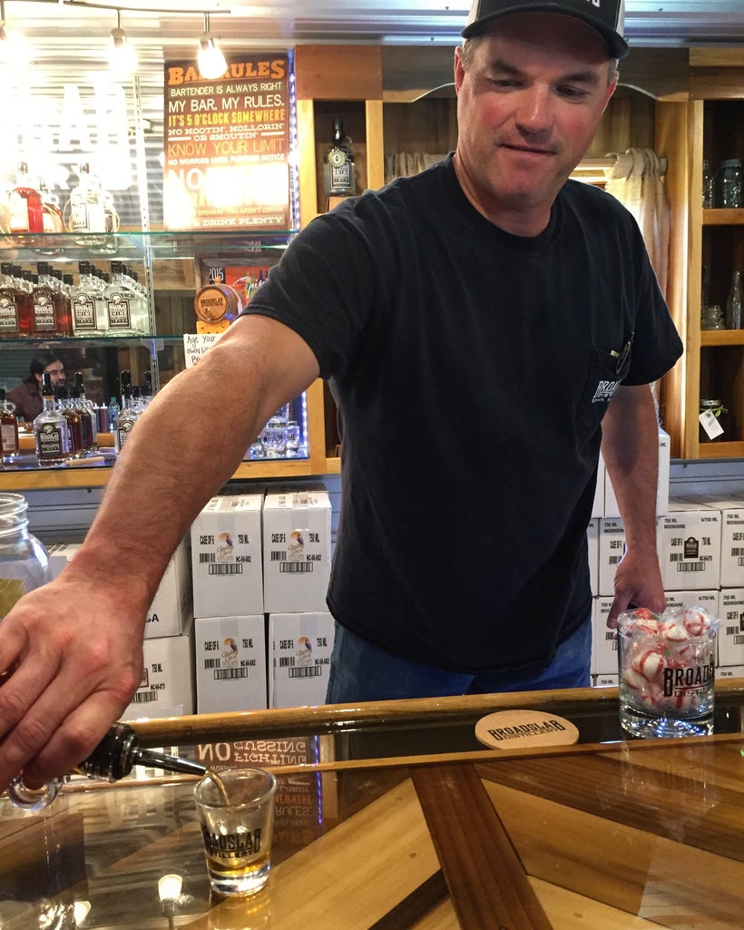 Jeremy Norris pours his Broadslab moonshine on tours, which is made the same way four generations of his family have made it