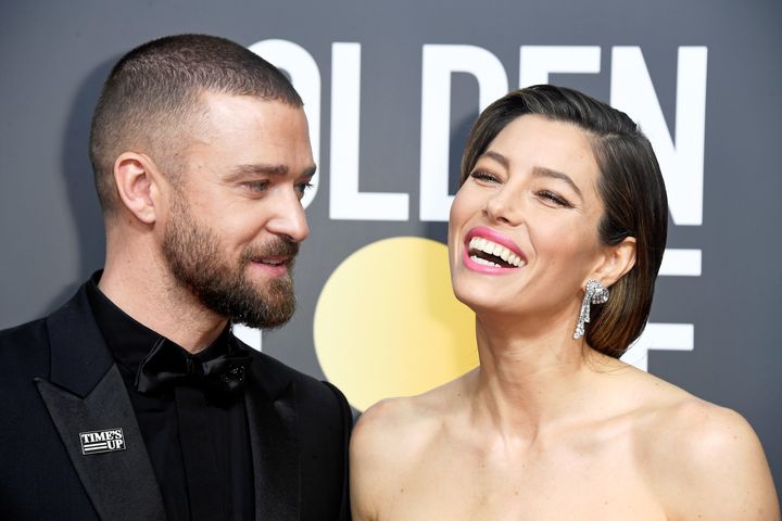 Justin Timberlake wearing a "Time's Up" pin with his wife, actress Jessica Biel, at Sunday night's Golden Globes.