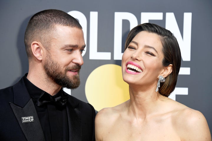 Justin Timberlake wearing a "Time's Up" pin with his wife, actress Jessica Biel, at Sunday night's Golden Globes.